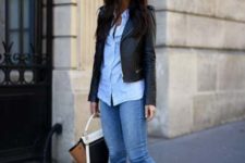 a blue shirt, blue cropped skinnies, black ankle booties, a cropped black leather jacket and a two-tone bag