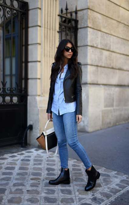 a blue shirt, blue cropped skinnies, black ankle booties, a cropped black leather jacket and a two-tone bag