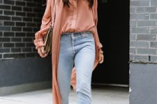 a coral shirt and a matching kimono, bleached straight jeans, snakeskin booties and a neutral bag