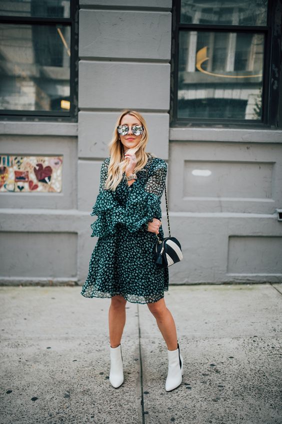 a green knee printed dress, white ankle boots, a two-tone bag for spring