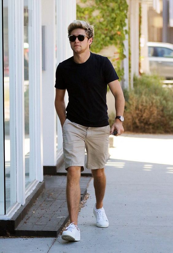 a black tee, tan shorts, white sneakers for a stylish and simple summer or vacation look