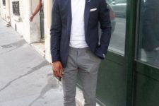 a casual summer work look with a white tee, a navy blazer, grey pants, brown loafers