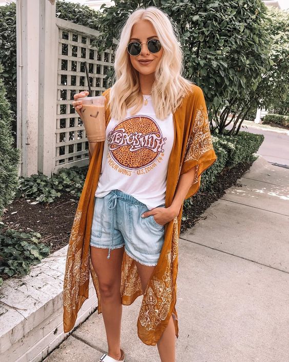 a printed tee, denim shorts, a mustard printed kimono and a necklace for a summer boho look