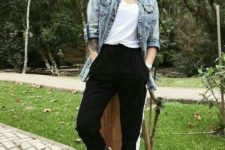 a casual outfit with a white top, black side stripe pants, black sneakers, a blue denim jacket