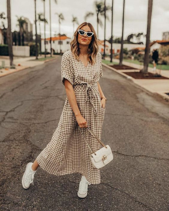 a neutral plaid wrap maxi dress with pockets, white sneakers and a white bag for an everyday look