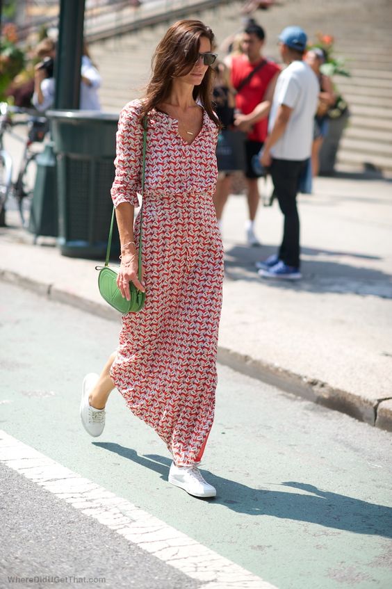 a red and white printed maxi dress, a green bag and white sneakers to look bright in summer