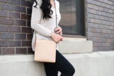 a neutral top with long sleeves, black skinnies, leopard flats and a blush bag for a chic look