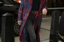 a black turtleneck, grey skinnies, red boots, a navy and red plaid midi coat for a bold Christmas look