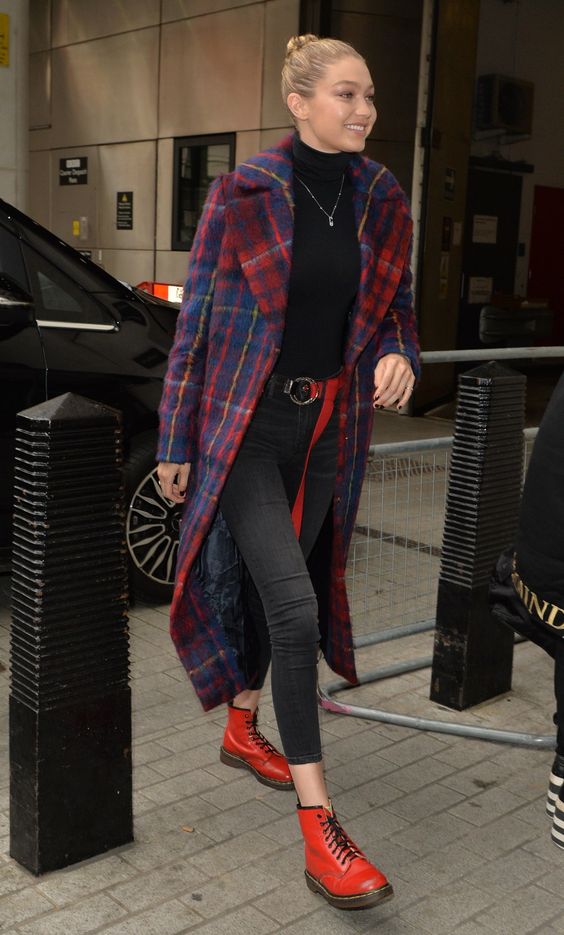 a black turtleneck, grey skinnies, red boots, a navy and red plaid midi coat for a bold Christmas look