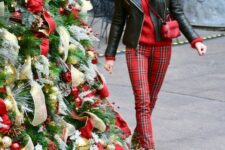 a bold outfit with a red sweater, red plaid pants, leopard print boots, a black leather jacket and a red bag