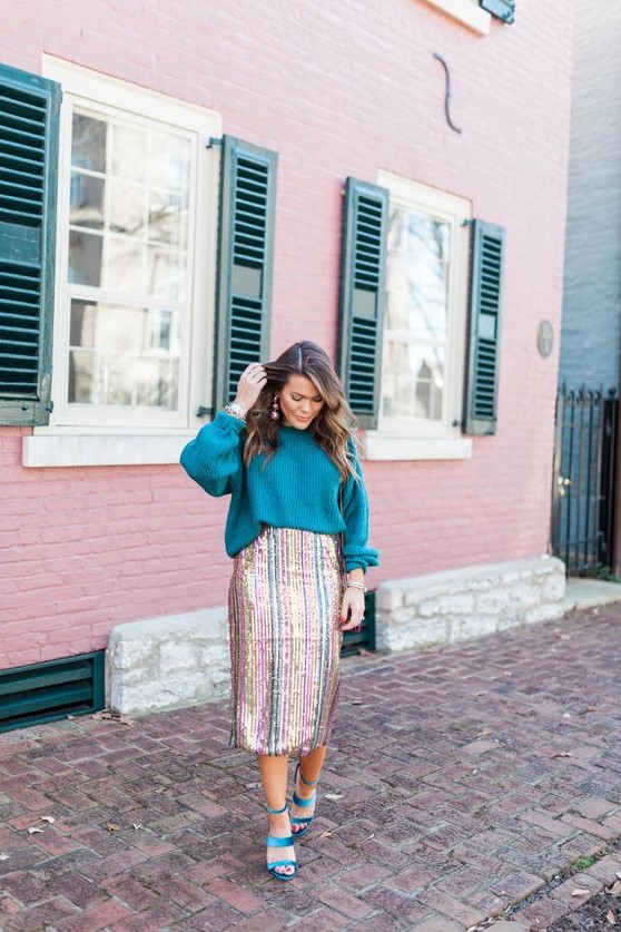 a colorful holiday outfit with a teal oversized sweater, a striped sequin midi and teal strappy shoes just wows