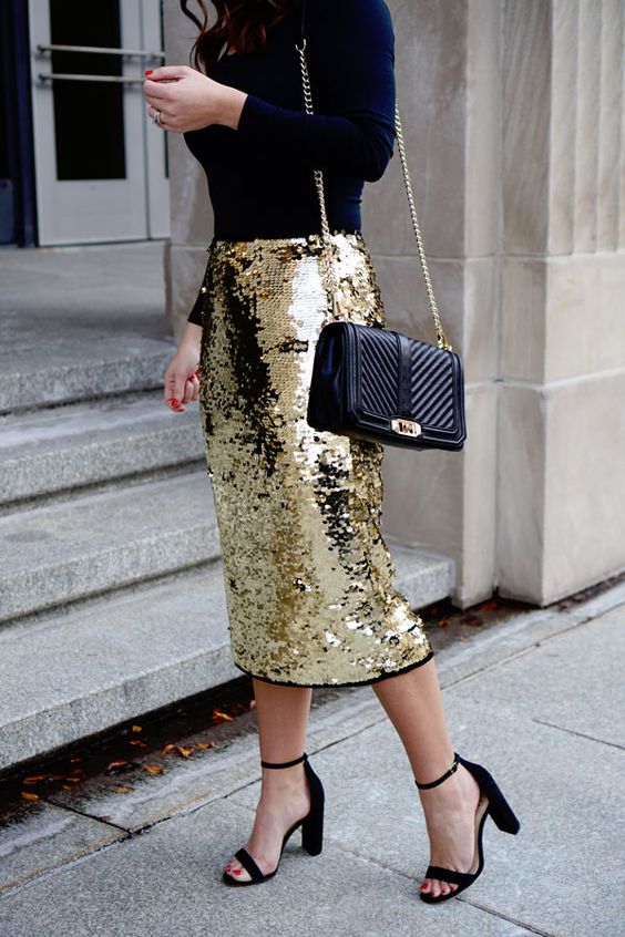 a navy turtleneck, a gold sequin pencil midi, a black bag and block heels are a chic and refined combo for the holidays