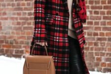 a neutral sweater, black leather pants, a red plaid coat, a leopard print scarf, a camel backpack and glasses