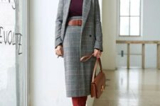 a sophisticated plaid grey skirt suit, a plum-colored turtleneck, a brown belt, burgundy boots and a brown bag