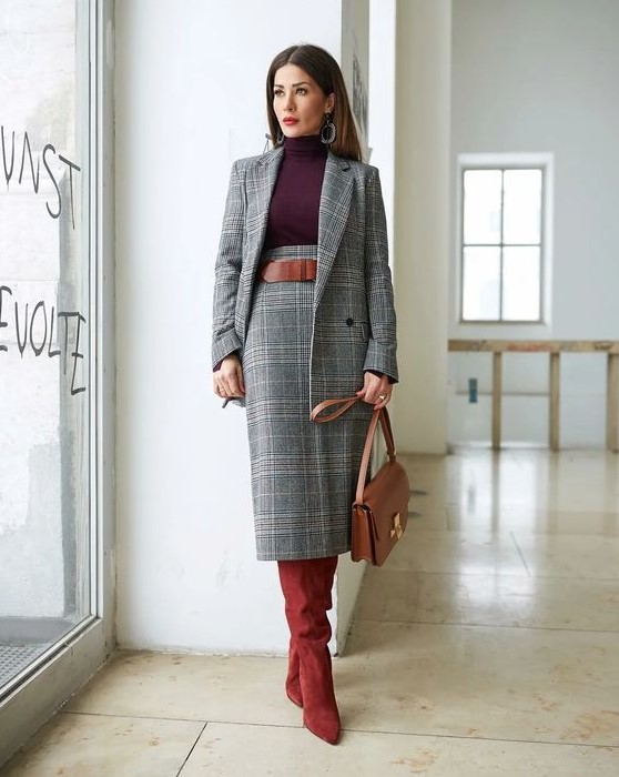 a sophisticated plaid grey skirt suit, a plum-colored turtleneck, a brown belt, burgundy boots and a brown bag