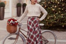 a vintage-inspired look with a white high neckline sweater, a plaid pleated midi, red shoes and a red lipstick