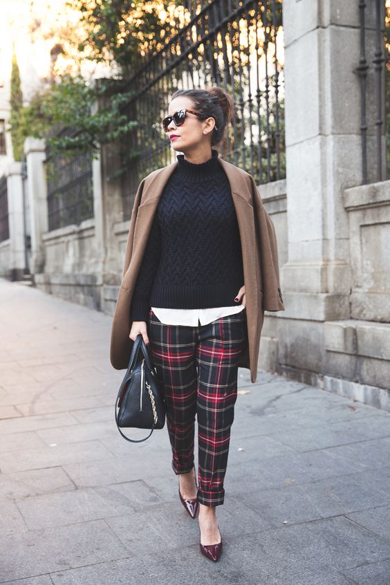 a white shirt, a black sweater, black and red plaid pants, burgundy shoes, a camel coat and a black bag for Christmas