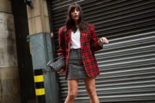 a white t-shirt, a grey skirt, black boots, a red plaid blaer and a woven bag are a lovely look for Christmas