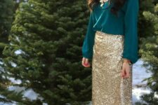 an emerald shirt, a statement gold necklace, a gold sequin skirt and nude Valentino shoes