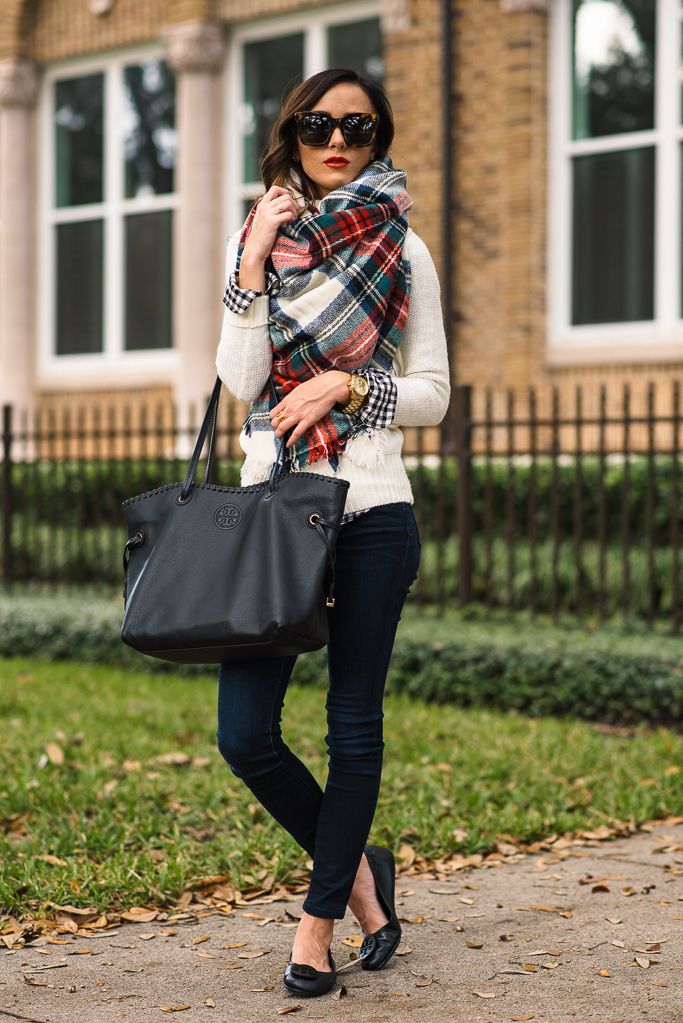 a white jumper, black skinnies, black flats, a red, green and white plaid scarf as an accent and a black bag