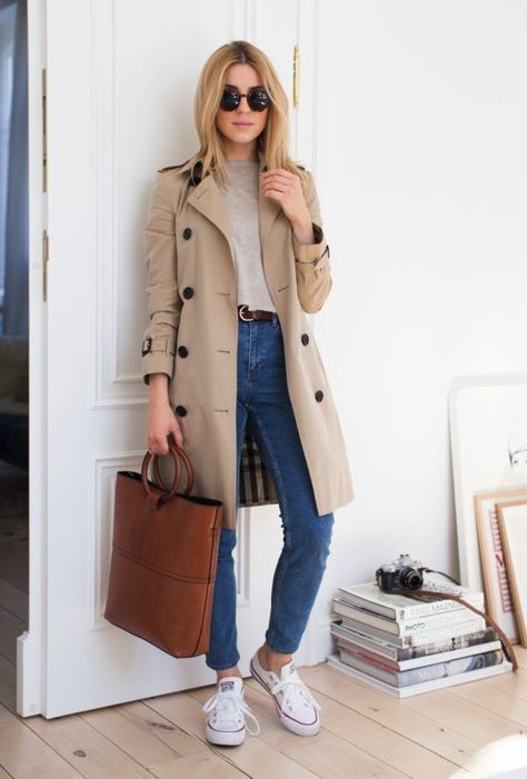 a neutral top, blue mom jeans, white sneakers, a nuetral classic trench and a brown tote