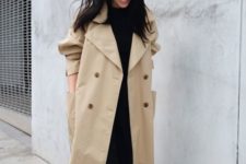 a tan oversized double-breasted trench with bold buttons and large pockets for spring
