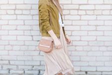 a white tee, a blush pelated skirt, nude flats, a pink bag and a mustard-colored bomber jacket