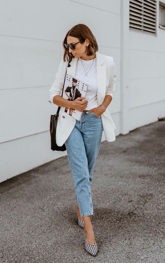 a white top, a white oversized blazer, light blue cropped jeans, printed shoes and a black bag