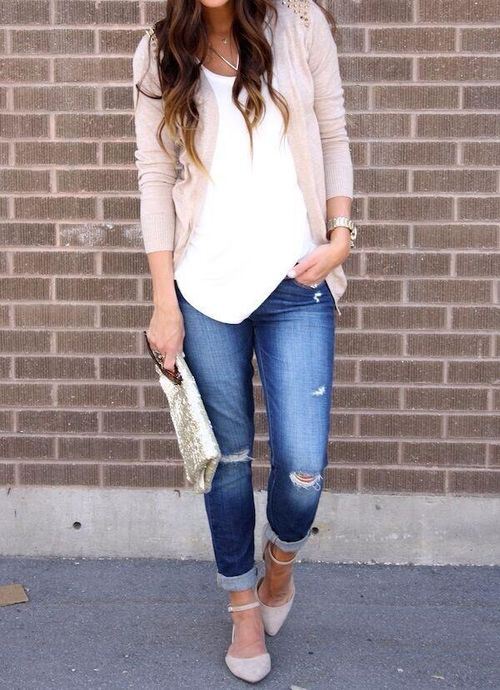 navy ripped jeans, a white top, a tan cardigan, white flats and a metallic clutch for a spring feel