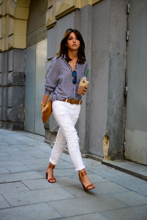 a checked shirt, white jeans, brown shoes with block heels and a belt plsu a brown clutch