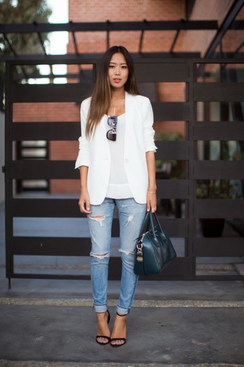 a white top, a white blazer, blue ripped jeans, a teal bag and black heels for a spring to summer look