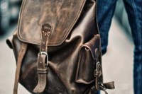 a dark leather backpack with a vintage feel is a stylish bag idea to rock anytime
