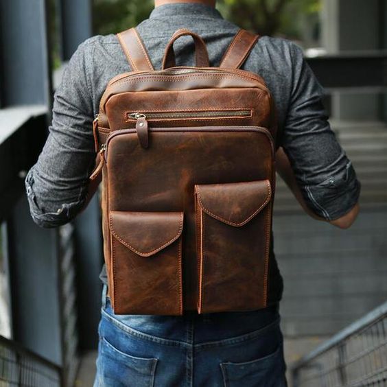 a chic brown leather backpack with various pockets is stylish and very comfy in using