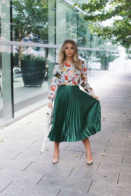 a floral long sleeve top, a green plated midi skirt, nude shoes and a white bag for a cool spring feel
