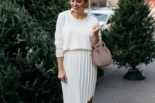 a white spring look with an oversized top, a pleated asymmetrical midi skirt, blush shoes, tassel earrings and a dusty pink bag
