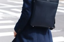 an super minimalist navy backpack is a cool accessory to rock with any ultra-modern look