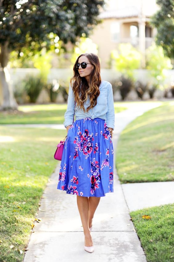 a colorful spring look with a blue chambray shirt, a colorful floral A-line skirt, a fuchsia bag and light pink shoes