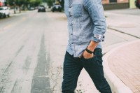 a chambray shirt, navy jeans, grey sneakers for a relaxed double denim look