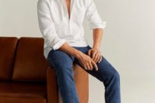 a white long sleeve shirt, blue jeans and white sneakers for a casual summer look