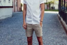 a white short sleeve shirt, tan shorts, two tone shoes for a simple summer outfit