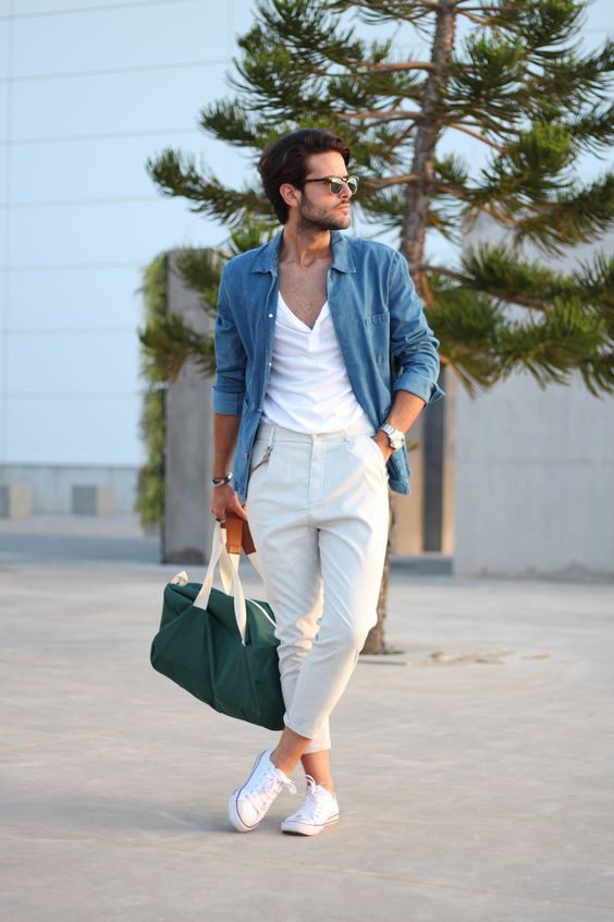 a white tee, white pants, a blu chambray shirt, white sneakers and a green bag for every day