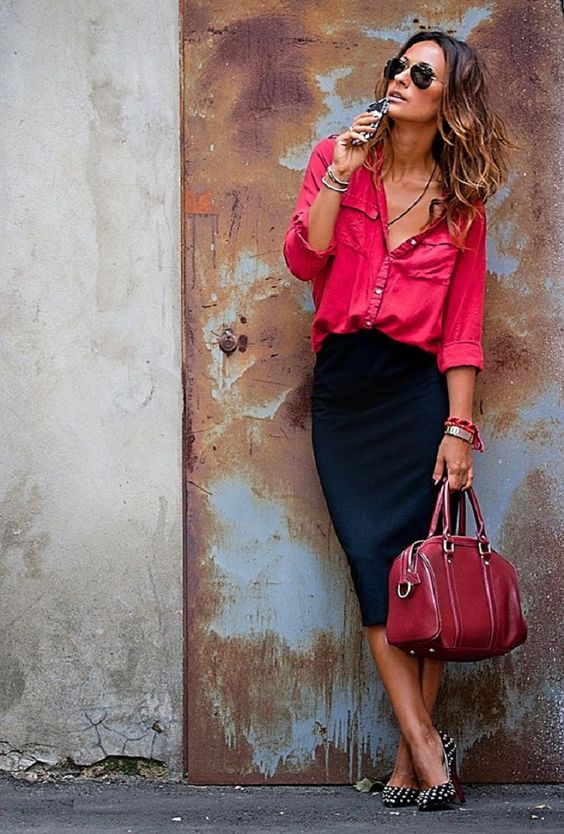 a bright work look with a pink shirt, a black pencil skirt, a red bag and black pearly shoes