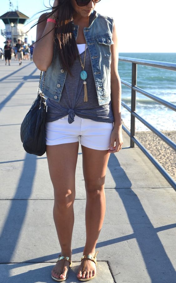 white shorts, a white top, a grey top and a denim vest