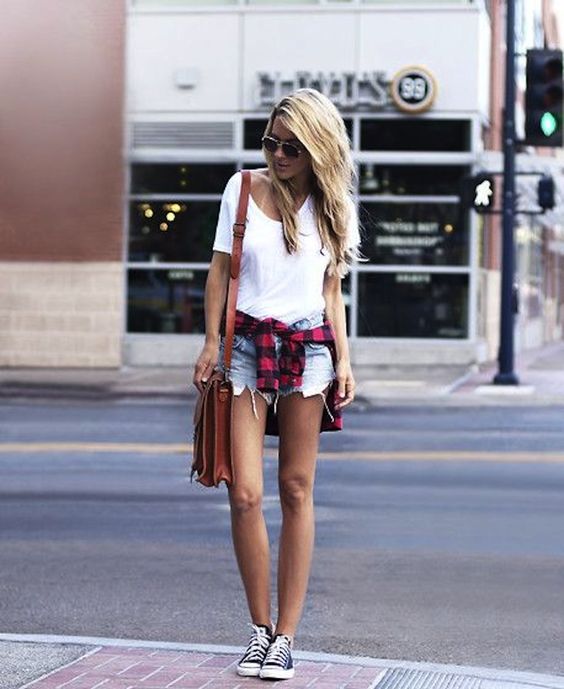 distressed denim shorts, a white tee, a checked shirt and converse
