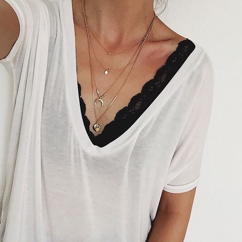 black lace bandeau and a white tee