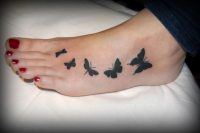 16 butterfly tattoo on a foot