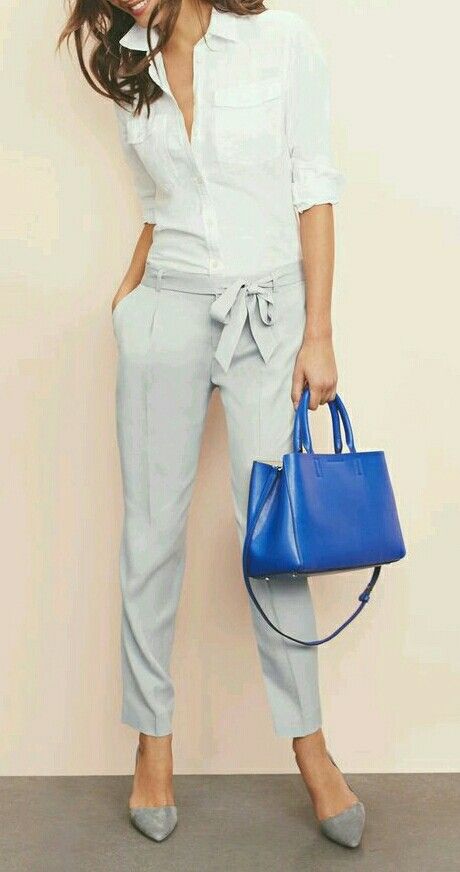 grey pants with a bow and a white shirt with an accent purse