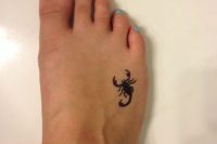 23 scorpion foot tattoo