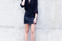 Black lace up blouse with leather skirt