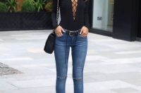 Black lace up top with skinny jeans